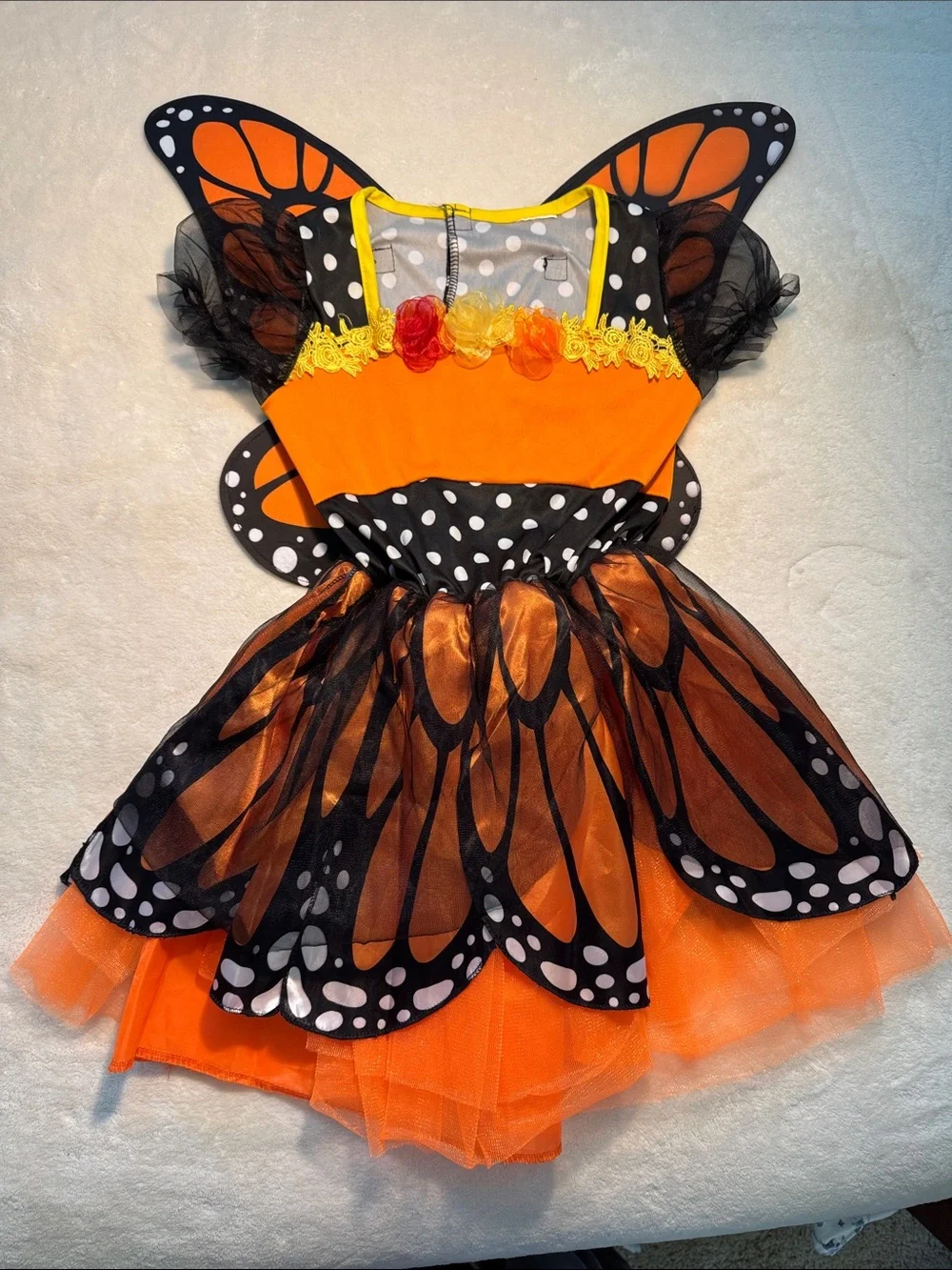 Halloween children’s orange and black monarch butterfly costume. Removable wings